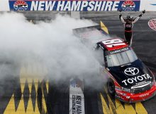 Kyle Busch salutes the fans with donuts and a wave over the granite strip start/finish line after Busch claimed his 21st career NASCAR Camping World Truck Series win on Saturday at New Hampshire Motor Speedway in Loudon, N.H. Credit: Getty Images for NASCAR